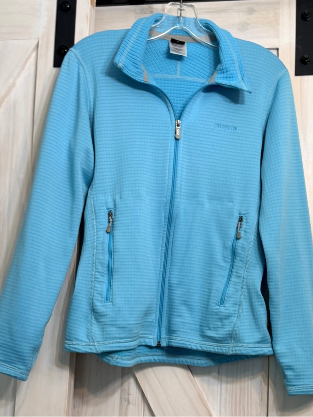 Patagonia Polyester light blue front zip jacket with zip pockets. Medium